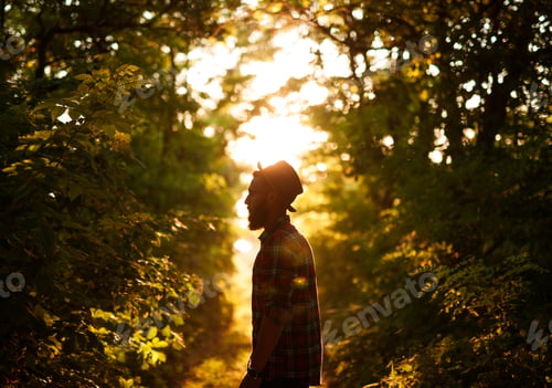 Preview: Stylish man in forest