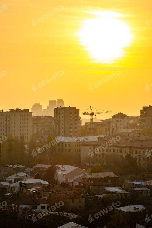 Preview: setting sun over house in Yerevan at smoggy sunset