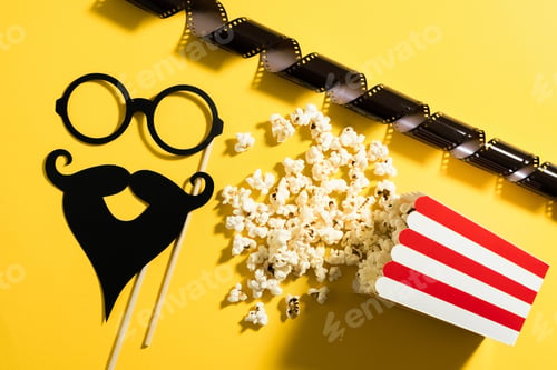 Preview: Popcorn bucket and photo booth prop for movie party on yellow background