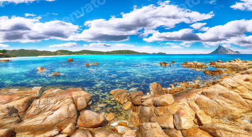 Preview: Fantastic azure water with rocks near beach Porto Taverna.