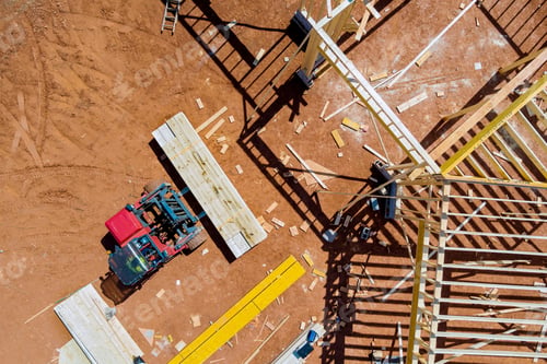 Preview: Lift manipulator unloads wooden delivered building material on construction site