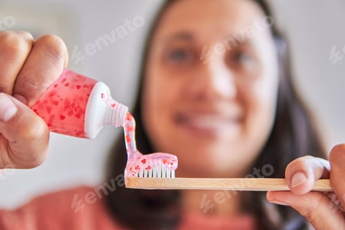 Preview: saint valentine toothpaste tube and tooth brush used by happy lady