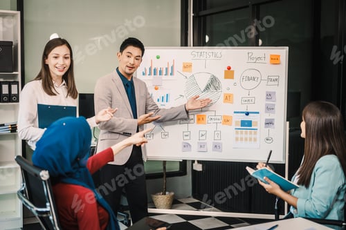Preview: A diverse team, including a middle-aged Asian businessman, Caucasian young businesswoman