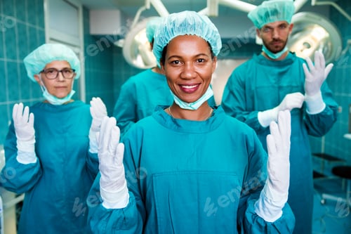 Preview: Team of surgeons in the operating room preparing for surgery