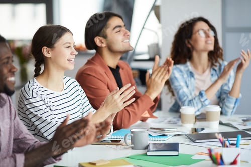 Preview: Row of Young Business People Applauding