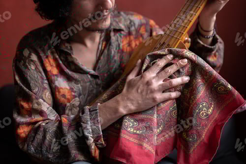 Preview: A young Mexican musician is cleaning his jarana guitar