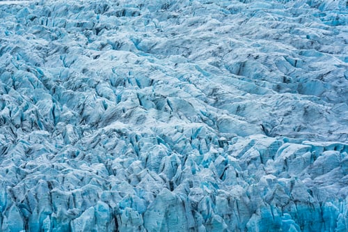 Preview: Rugged textured natural blue iceberg in Fjallsarlon iceberg lagoon