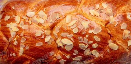 Preview: Easter sweet bread, Greek tsoureki braid background texture, Closeup above view