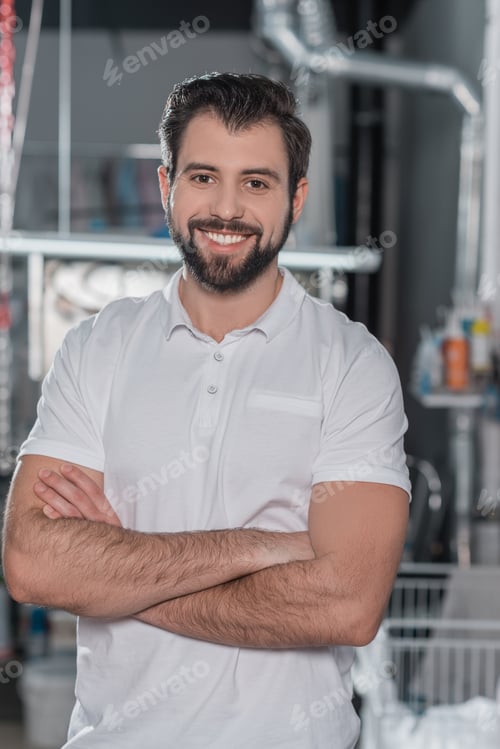 Preview: dry cleaning worker with crossed arms