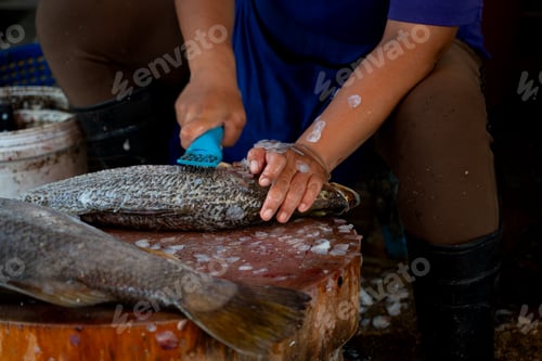 Preview: A man scales fish at a wet market in Hatyai, Thailand