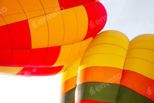 Preview: Vibrant Hot Air Balloons Soaring Against a Bright Sky: A Colorful Aerial Adventure