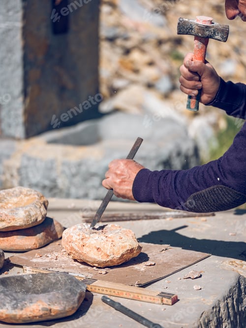 Preview: Crop artisan shaping stone with chisel and hammer