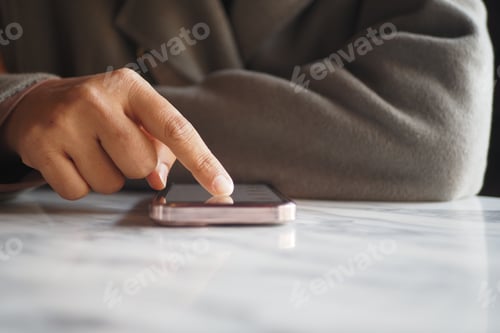 Preview: women hand holding smart phone sitting on cafe