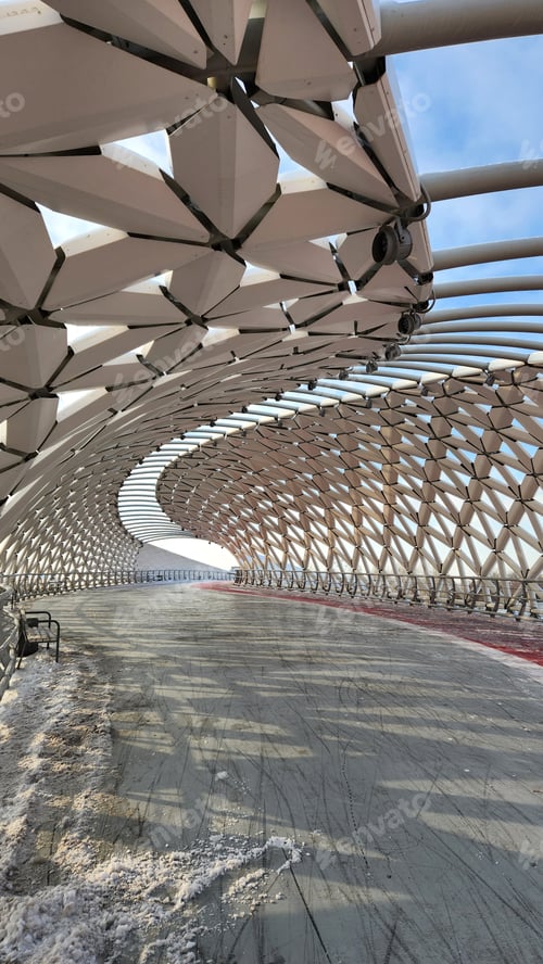 Preview: Modern architectural urbanistic Atyrau fish bridge across Ishim river. Pedestrian bridge with