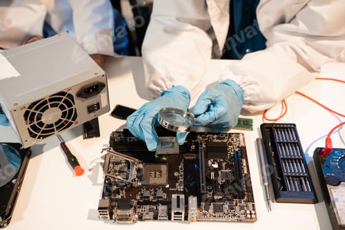 Preview: Technician measuring voltage electronic circuit board, Service after sale fix electric equipment.