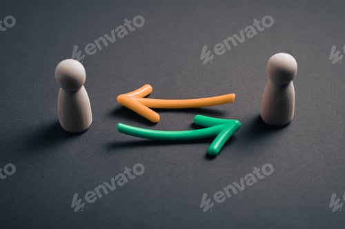 Preview: Two wooden figures with arrows representing two-way communication and feedback loops in a business.