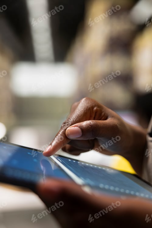 Preview: Close up of female employee overseeing industrial cargo inventory