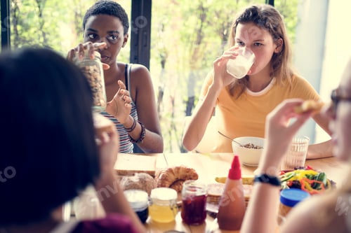 Preview: Group of diverse women having breakfast together