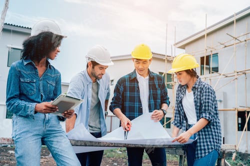 Preview: Team of Construction workers engineers working on site.