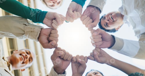 Preview: Fist bump, low angle and friends with fashion, circle and support for motivation, smile and happine