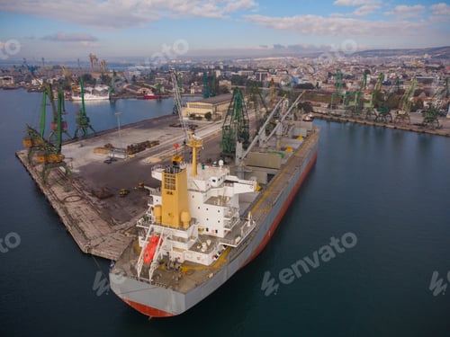 Preview: Aerial view of big cargo ship bulk carrier is loaded with coal in port