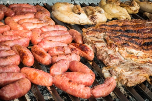 Preview: Meat baked on the grill. Sausages homemade sausages on the rill. Street food.