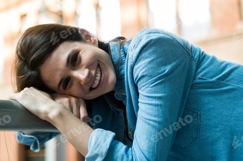Preview: Smiling girl at handrail