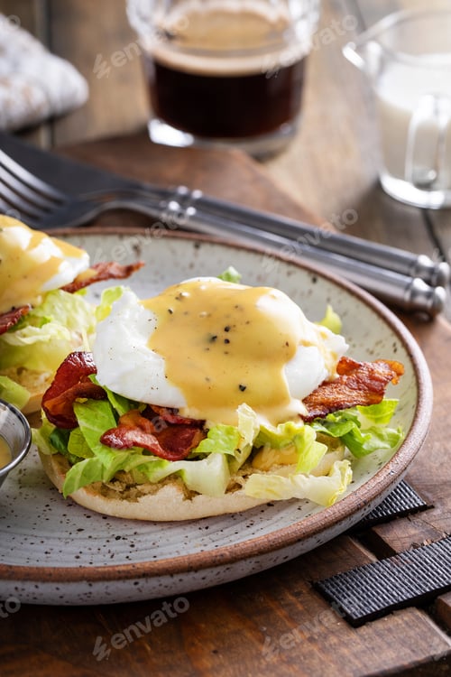 Preview: Eggs Benedict with bacon and lettuce on english muffins