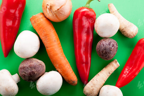 Preview: Top view of vegetables on green background