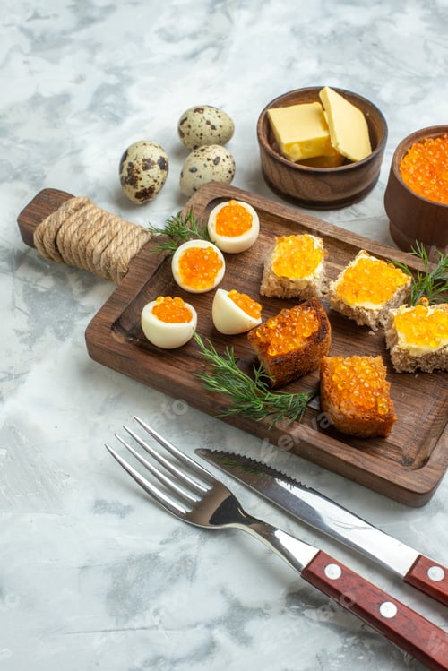 Preview: front view delicious sandwiches with caviar and boiled eggs on cutting board white surface