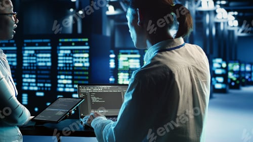 Preview: Coworkers programming in data center