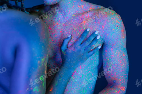 Preview: partial view of young and passionate african american woman touching bare-chested man with muscular