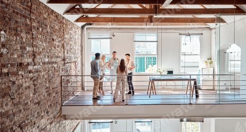 Preview: Group of diverse architects discussing plans, blueprints and schematics during a meeting in their o