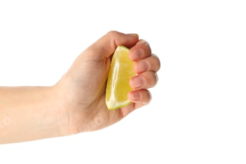 Preview: Female hand hold lime slice, isolated on white background