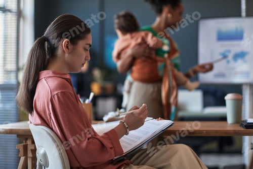 Preview: Working Professionals in Office Setting Collaborating on Projects