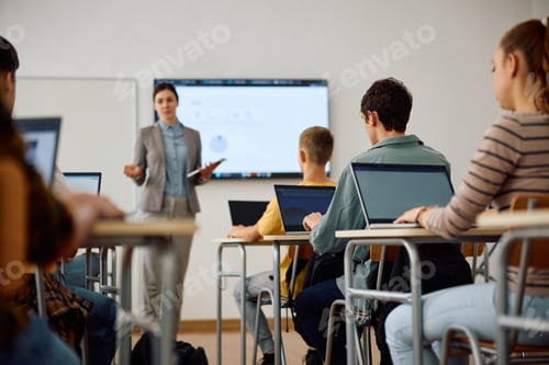 Preview: Group of high school students attending computer class in the classroom.