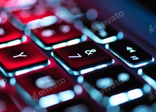 Preview: Night-lit laptop computer focusing on the keyboard