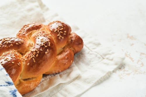 Preview: Challah bread. Sabbath kiddush ceremony composition. Freshly baked homemade braided challah bread fo