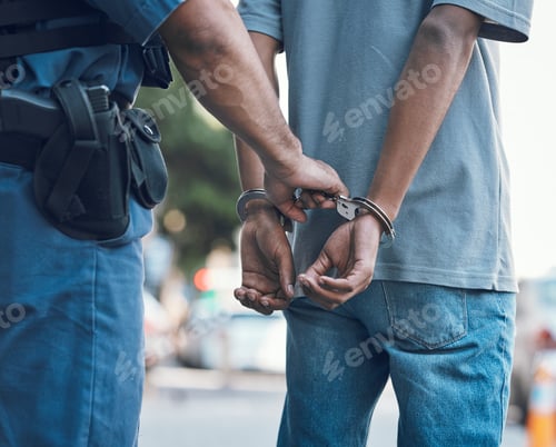 Preview: Handcuffs, police and hands of police man with criminal in city for justice, crime or corruption. I