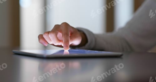 Preview: Woman finger touch on tablet computer at home