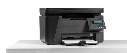 Preview: Printer on a table ready for use with documents waiting to be printed and scanned