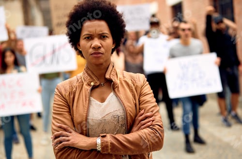 Preview: African American woman with arms crossed on Black lives Matter protest.