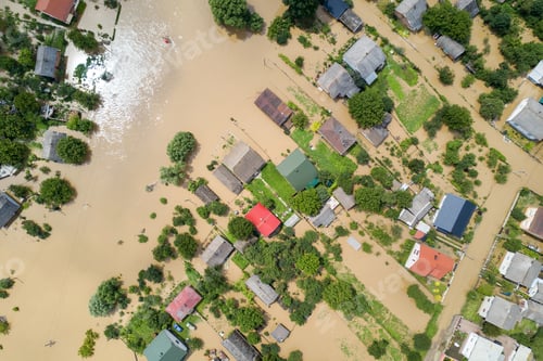 Preview: Aerial view of flooded houses with dirty water of Dnister river in Halych town, western Ukraine.