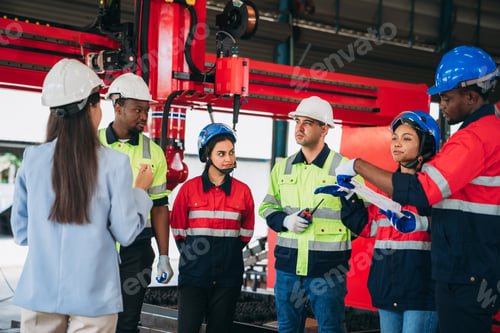 Preview: Engineers and foreman inspecting and meeting about the automated arms machine welding robots.