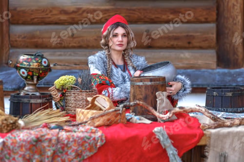 Preview: A girl in traditional Russian clothes and a kokoshnik stands at a table with various national dishes