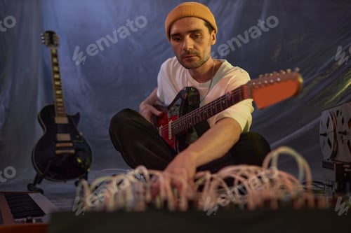 Preview: Male Guitarist Preparing Musical Equipment