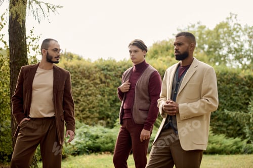 Preview: Three handsome men showcase stylish autumn fashion in a serene natural setting during fall