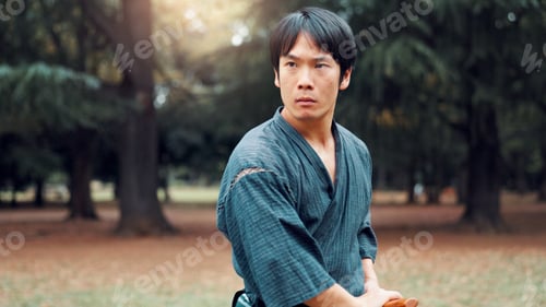 Preview: Wooden sword, Japanese man and outdoor in training, exercise and sports for martial arts or aikido.