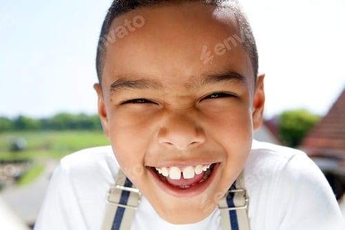 Preview: Portrait of a smiling little boy with suspenders