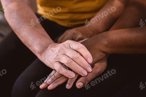 Preview: Diverse hands stacked together, showing support, community and friendship concept